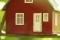 The picture shows a model house on the branch of a tree as a sign of energy self-sufficiency