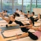 Image of the participants doing hot yoga at EcoCharm event.
