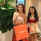 Image of participants with their goodie bags at the EcoCharm Hot Yoga event.